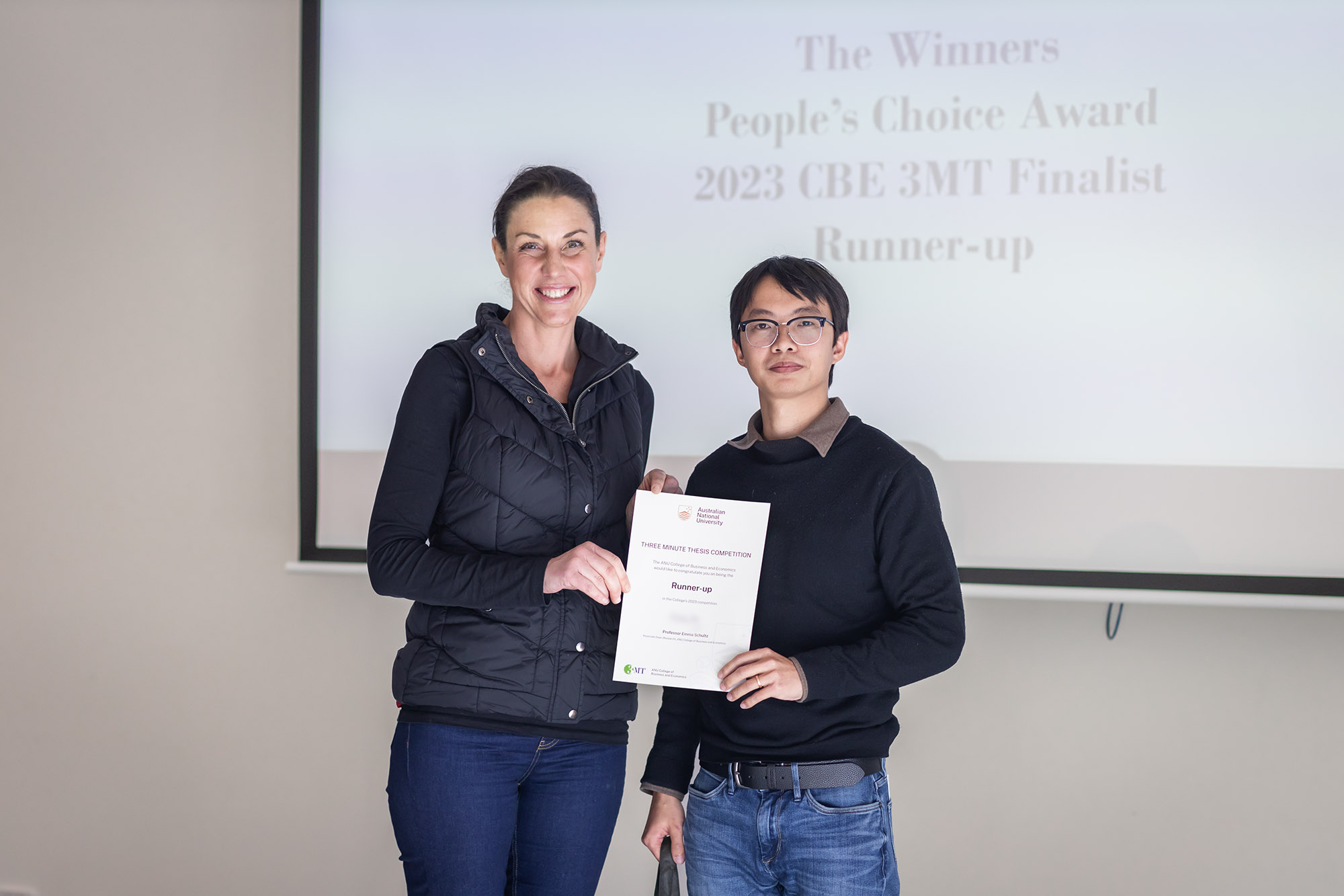 Photo (L-R): Professor Emma Shultz (Dean, Research) and runner-up Zeming Wang