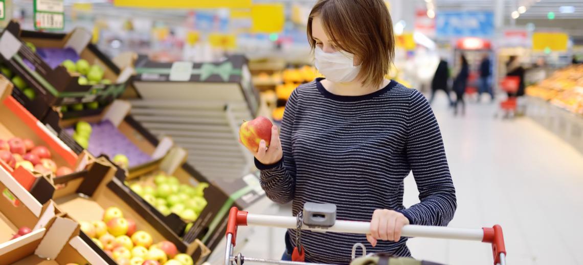 Woman wearing a face mask while grocery shopping