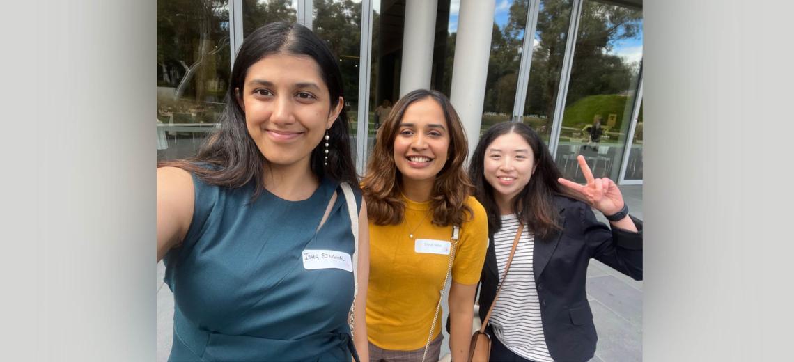 Isha, Shruti and Ashley standing side-by-side in a selfie taken by Isha.